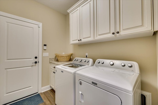 186 Tara Dr, Mccormick, SC 29835 - laundry room with separate washer and dryer, cabinet space, baseboards, and wood finished floors