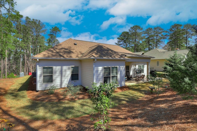 186 Tara Dr, Mccormick, SC 29835 - view of side of property featuring a yard, roof with shingles, and a patio