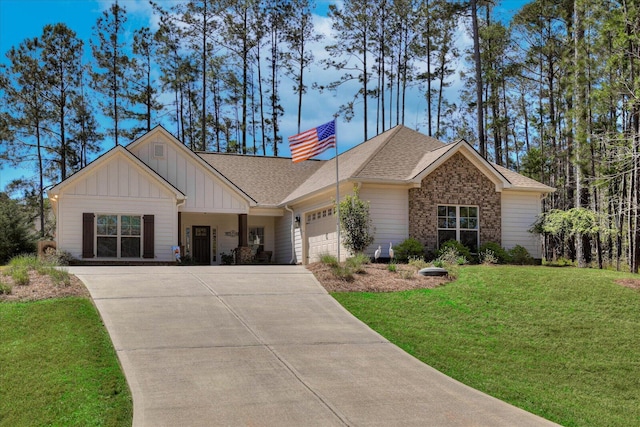 186 Tara Dr, Mccormick, SC 29835 - view of front facade with board and batten siding, driveway, a garage, a shingled roof, and a front lawn
