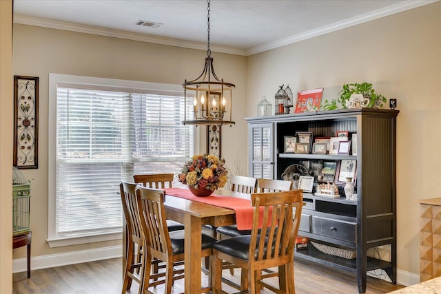 186 Tara Dr, Mccormick, SC 29835 - dining area with baseboards, a chandelier, visible vents, and wood finished floors