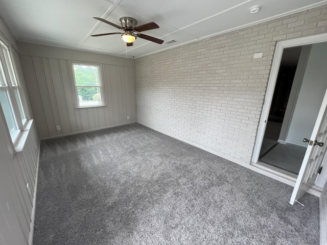 202 Hillview Dr, Graniteville, SC 29829 - unfurnished room featuring brick wall, carpet floors, ceiling fan, and a smoke detector