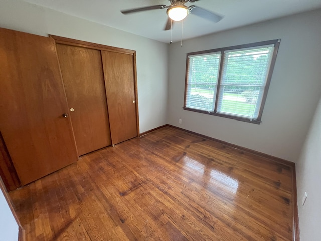 202 Hillview Dr, Graniteville, SC 29829 - unfurnished bedroom featuring wood finished floors, a closet, and a ceiling fan