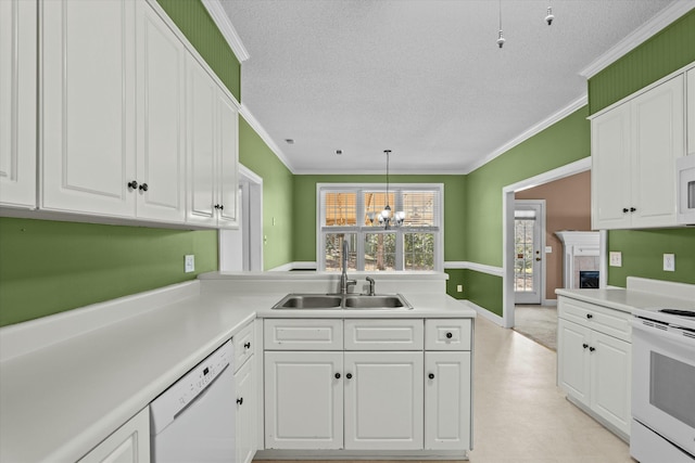 kitchen featuring white appliances, white cabinets, ornamental molding, and a sink