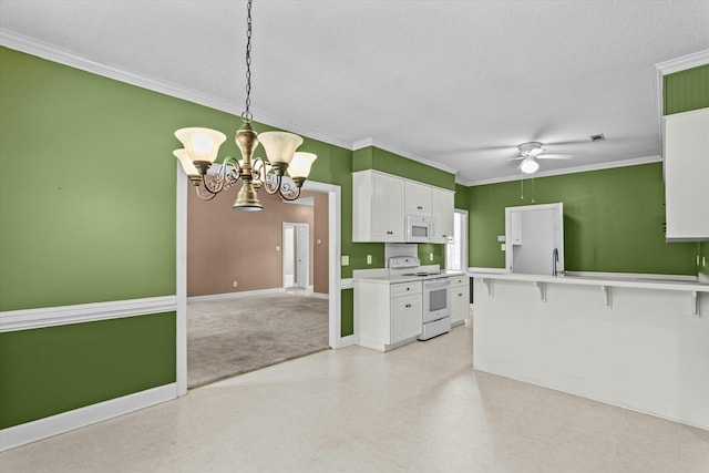 kitchen featuring crown molding, light countertops, ceiling fan with notable chandelier, white cabinets, and white appliances