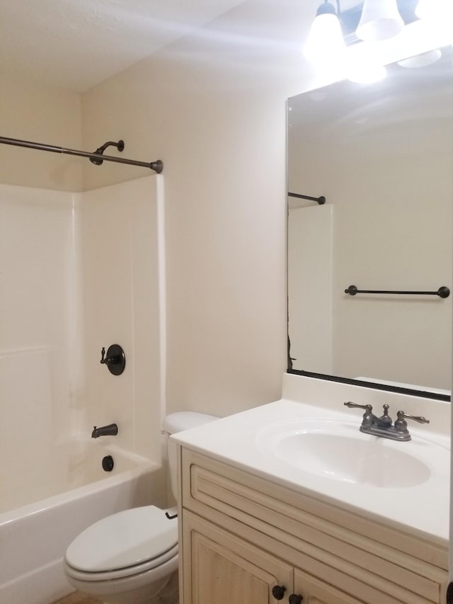 bathroom featuring shower / bathtub combination, vanity, and toilet