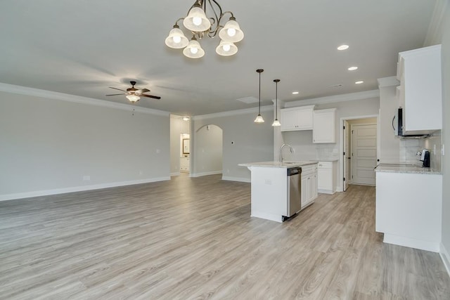 kitchen featuring white cabinetry, hanging light fixtures, stainless steel dishwasher, an island with sink, and backsplash