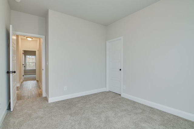 empty room with light colored carpet