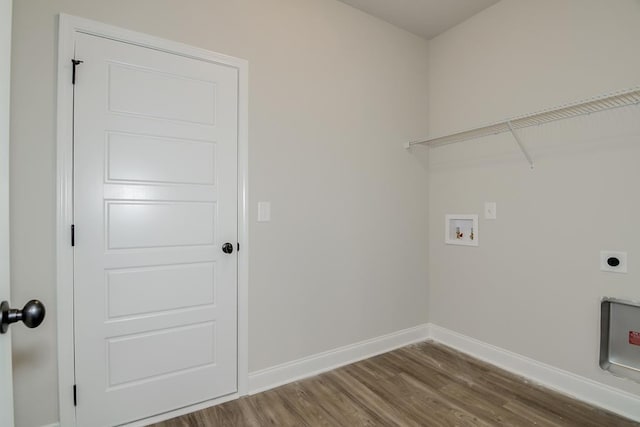 washroom with hardwood / wood-style floors, hookup for a washing machine, and hookup for an electric dryer