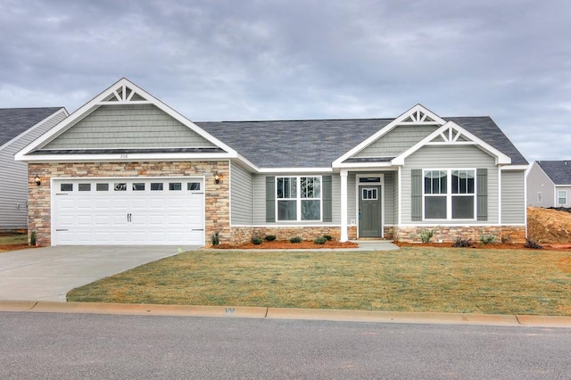 craftsman-style home featuring a garage and a front lawn