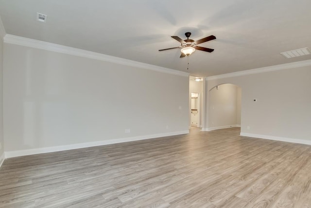 unfurnished room with ornamental molding, ceiling fan, and light wood-type flooring