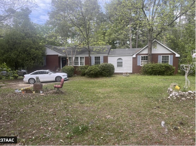 ranch-style home with a front yard