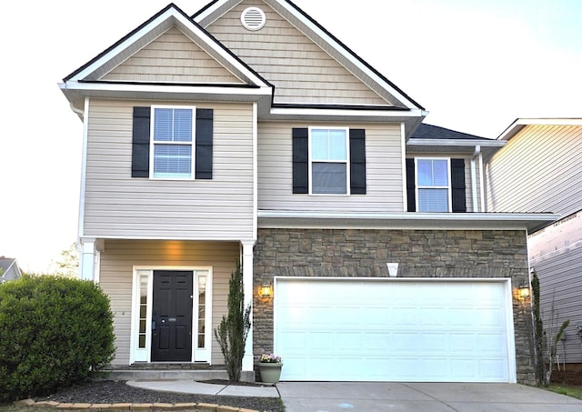 631 Dunrobin Ln, Grovetown, GA 30813 - view of front of home featuring stone siding, driveway, and an attached garage