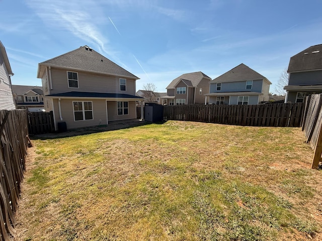 631 Dunrobin Ln, Grovetown, GA 30813 - view of yard with an outdoor structure, a fenced backyard, a residential view, and a storage shed