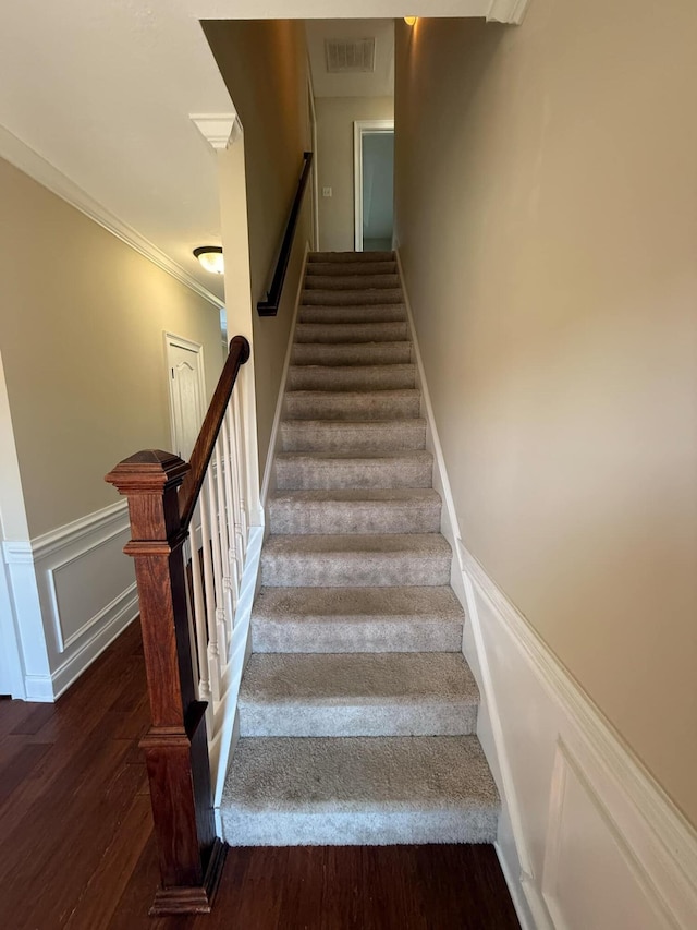 631 Dunrobin Ln, Grovetown, GA 30813 - stairway featuring a wainscoted wall, visible vents, a decorative wall, ornamental molding, and wood finished floors