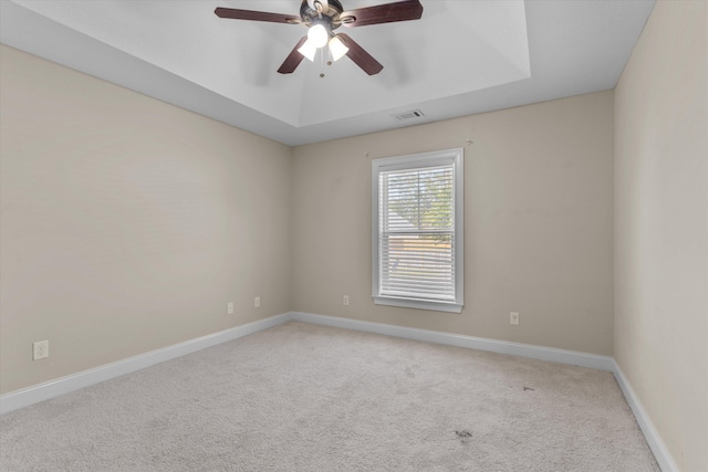 631 Dunrobin Ln, Grovetown, GA 30813 - unfurnished room with light colored carpet, baseboards, visible vents, a raised ceiling, and a ceiling fan