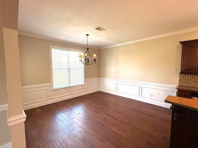 631 Dunrobin Ln, Grovetown, GA 30813 - unfurnished dining area with a wainscoted wall, an inviting chandelier, visible vents, and dark wood-style flooring