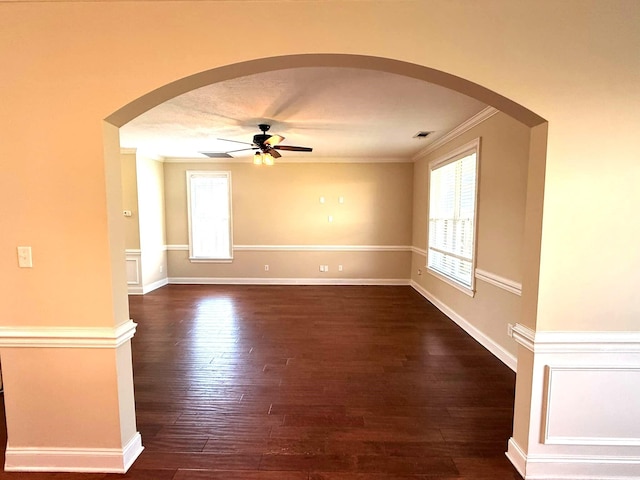 631 Dunrobin Ln, Grovetown, GA 30813 - spare room with ceiling fan, arched walkways, crown molding, dark wood-style floors, and healthy amount of natural light