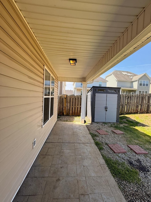 631 Dunrobin Ln, Grovetown, GA 30813 - view of patio featuring an outdoor structure, a storage shed, and a fenced backyard