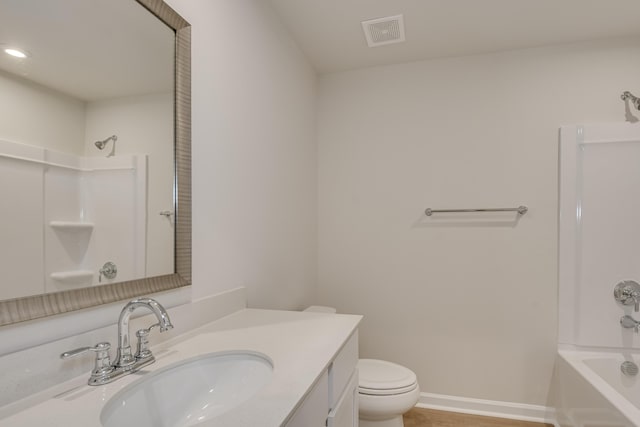 full bath featuring visible vents, toilet,  shower combination, baseboards, and vanity