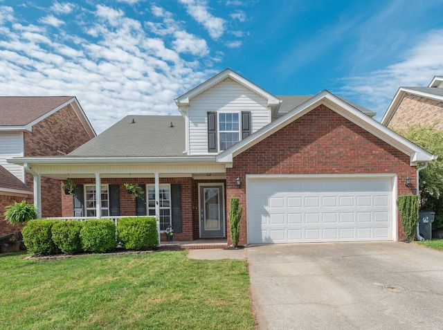 front facade featuring a front lawn, covered porch, and a garage