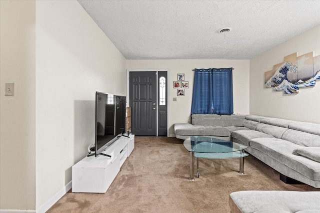 living room featuring carpet flooring and a textured ceiling