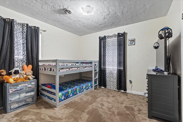 carpeted bedroom with a textured ceiling