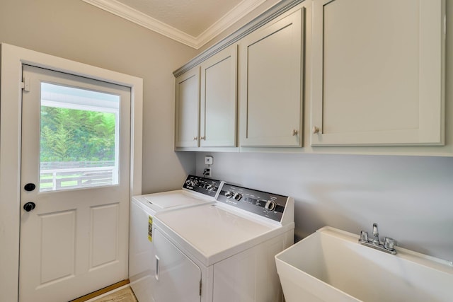 574 SW Newberry St, Aiken, SC 29801 - laundry area with cabinet space, washer and clothes dryer, and ornamental molding