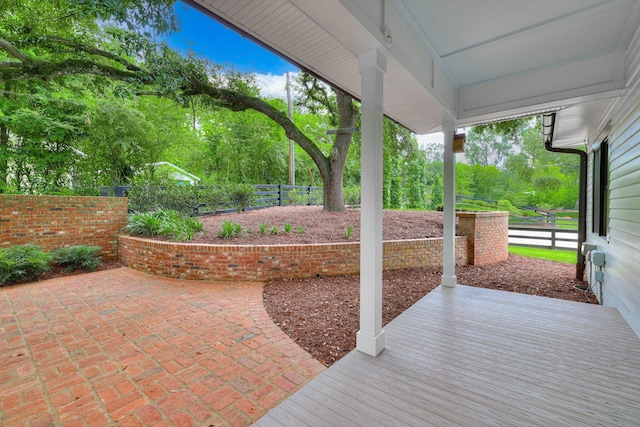 574 SW Newberry St, Aiken, SC 29801 - fenced backyard with a patio area and view of scattered trees