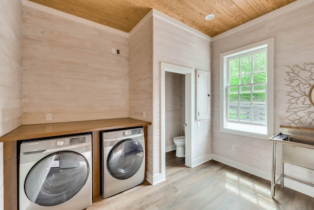 574 SW Newberry St, Aiken, SC 29801 - washroom featuring independent washer and dryer, wooden ceiling, wood finished floors, and wooden walls