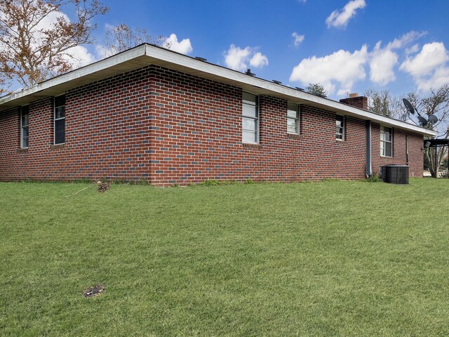 10236 S Ga Highway 23, Girard, GA 30426 - view of home's exterior featuring a yard and central AC