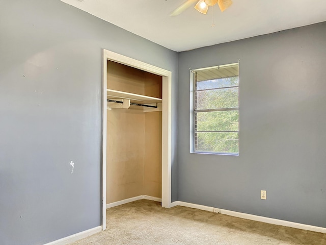 10236 S Ga Highway 23, Girard, GA 30426 - unfurnished bedroom with ceiling fan, light colored carpet, and a closet