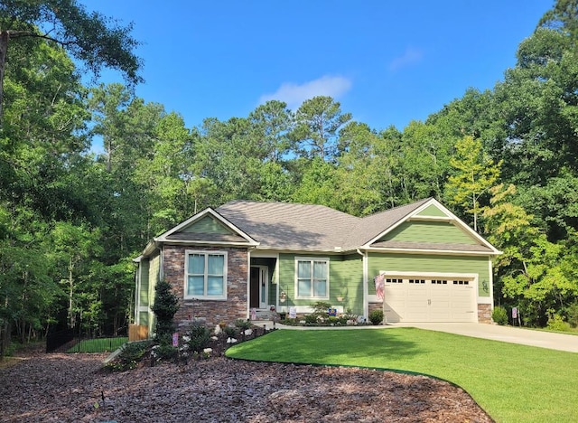 view of front of house featuring a garage and a front yard