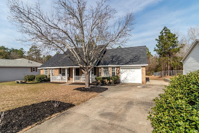 ranch-style home featuring a porch and a garage