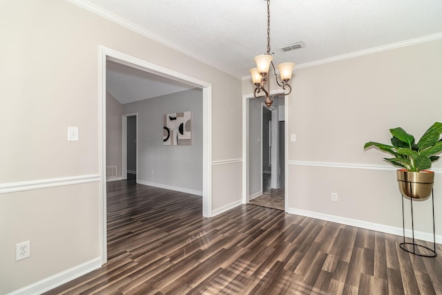 unfurnished dining area with a notable chandelier, ornamental molding, dark hardwood / wood-style floors, and a textured ceiling