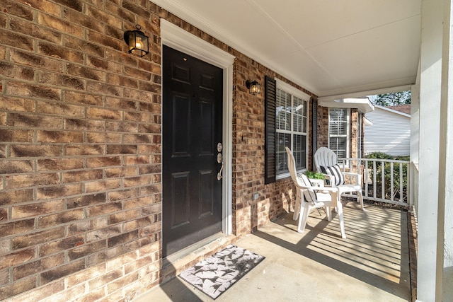 doorway to property featuring covered porch