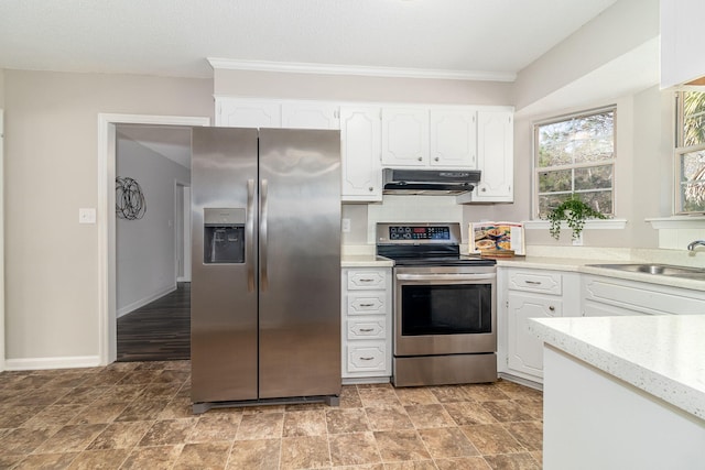 kitchen featuring appliances with stainless steel finishes, sink, and white cabinets