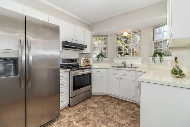 kitchen with sink, crown molding, white cabinets, and appliances with stainless steel finishes