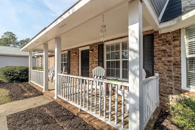 doorway to property with a porch