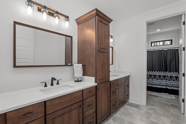 full bathroom with vanity, a shower with shower curtain, visible vents, and baseboards