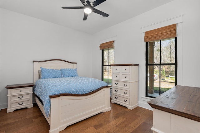 bedroom with dark wood-type flooring and ceiling fan