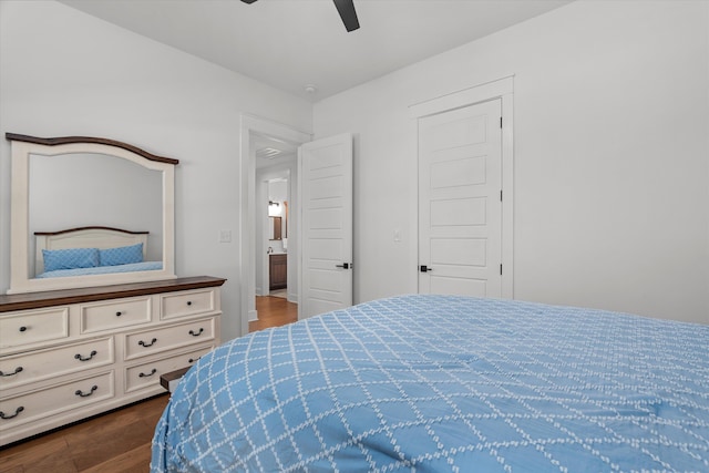 bedroom featuring dark wood-style floors and ceiling fan