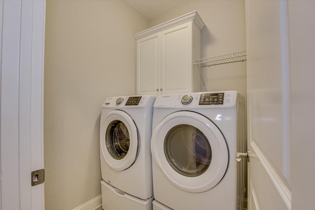 824 Brasstown Ct, Evans, GA 30809 - laundry room featuring washing machine and clothes dryer and cabinet space