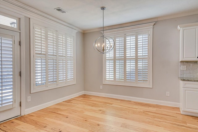 824 Brasstown Ct, Evans, GA 30809 - unfurnished dining area with a chandelier, light wood-type flooring, and ornamental molding