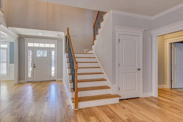 824 Brasstown Ct, Evans, GA 30809 - entrance foyer with light wood-style flooring, stairs, and ornamental molding