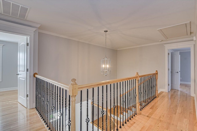 824 Brasstown Ct, Evans, GA 30809 - corridor featuring wood finished floors, an upstairs landing, and ornamental molding