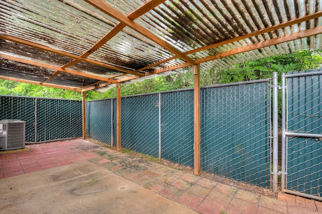 view of patio featuring a fenced backyard, a gate, central AC unit, and a pergola