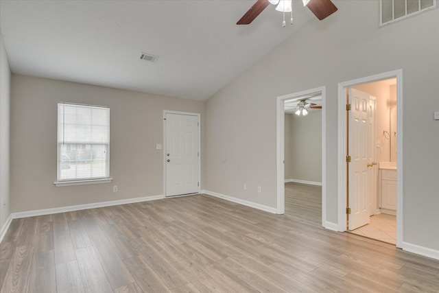 unfurnished living room featuring ceiling fan, visible vents, baseboards, and light wood finished floors