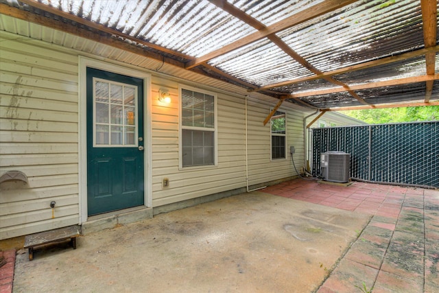 view of patio / terrace with fence and cooling unit