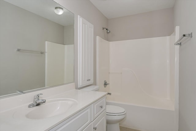 bathroom with vanity, toilet, and  shower combination