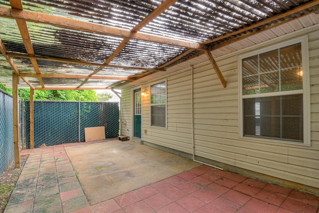 view of patio with a pergola and fence